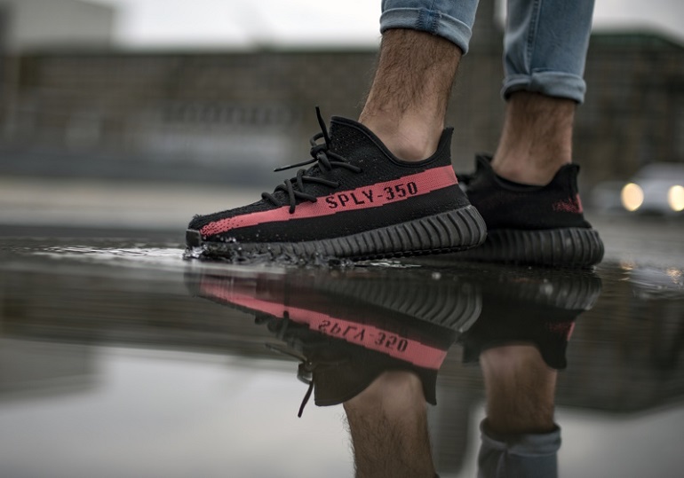 Milan, Italy - November 3, 2018: Man wearing a pair of Adidas Yeezy 350