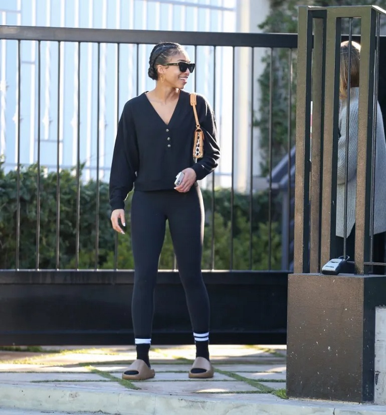 a celebrity wearing yeezy slides